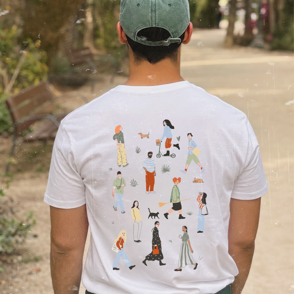 camiseta blanca de Laniñabowie modelo witches are back con ilustración en la espalda tamaño grande compuesta por diferentes personas entre las que se ocultan las famosas hermanas Sanderson de la película Hocus Pocus