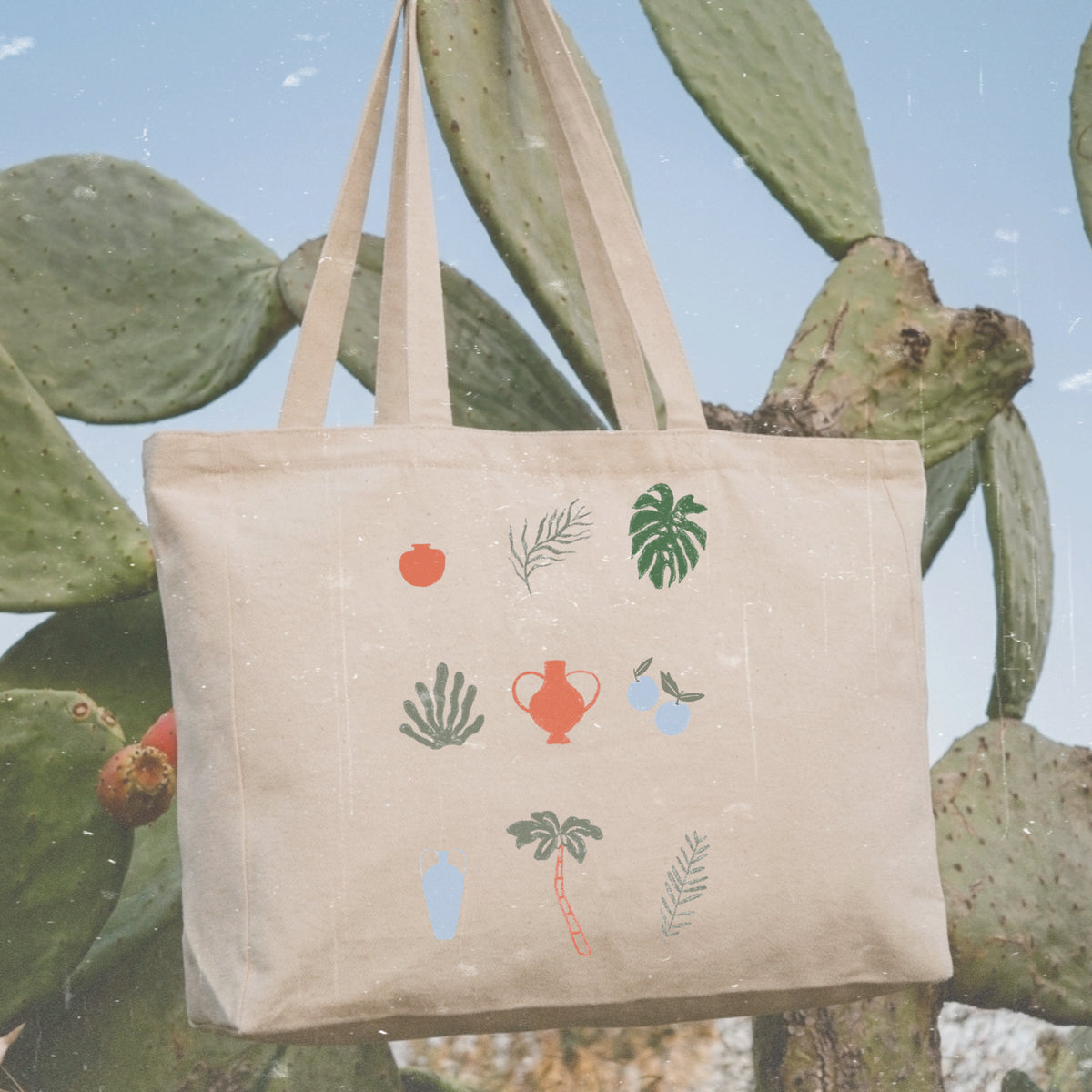 Bolso shopper de algodón con cremallera de Laniñabowie modelo "plant lover" con ilustración inspirada en plantas tropicales e invernaderos. frontal. 